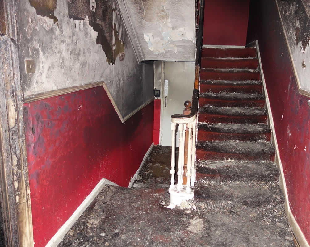 Fire damage claim - the staircase of a Georgian apartment building damaged by fire